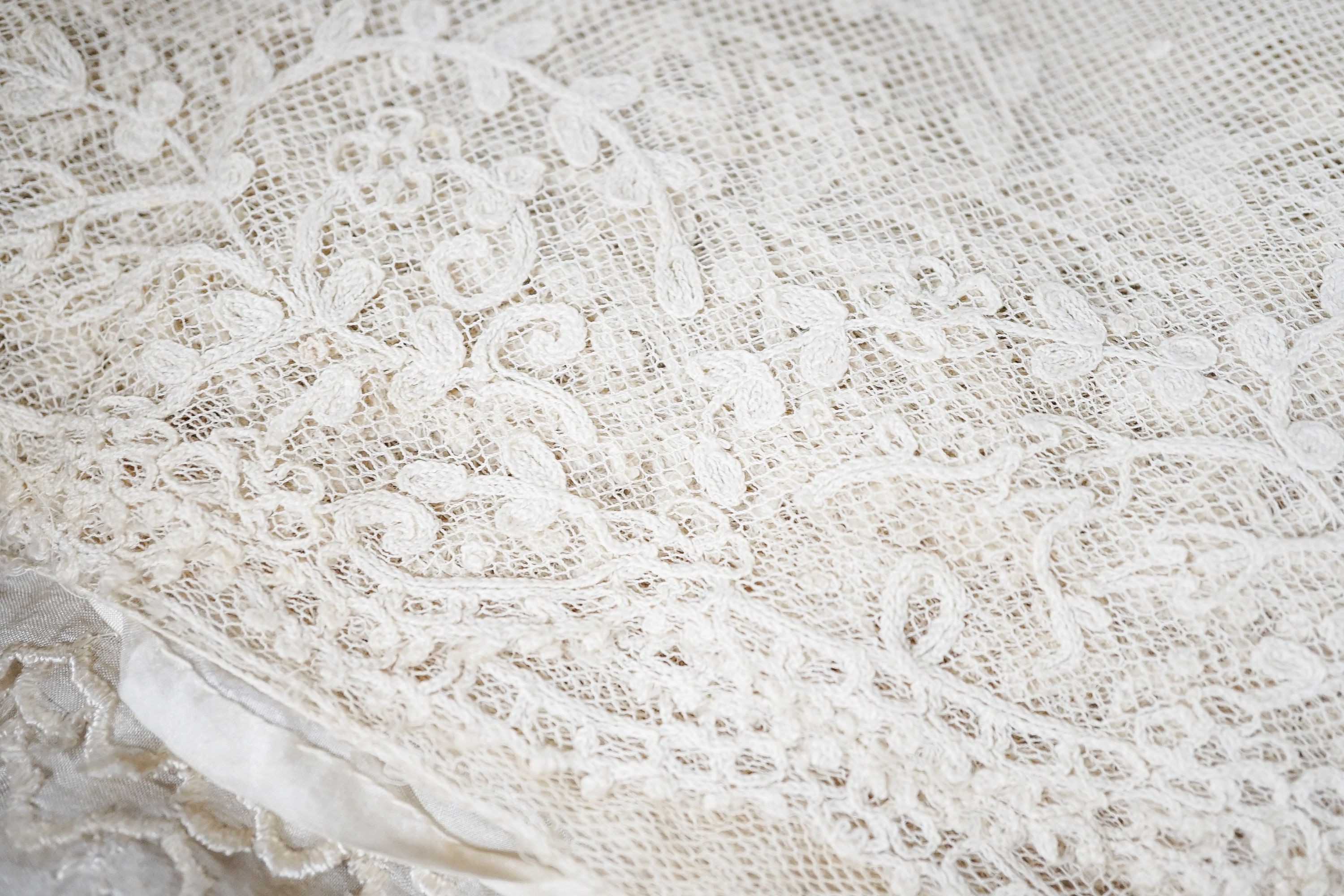 A large tape lace 'Bertha', various hand made laces, lengths of needle run laces, a skirt panel etc.